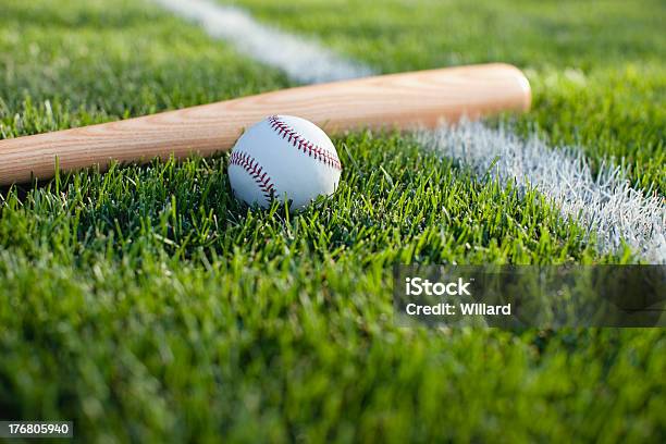 Baseball And Bat On Grass Field With White Stripe Stock Photo - Download Image Now - Baseball - Sport, Baseball - Ball, Sports Field