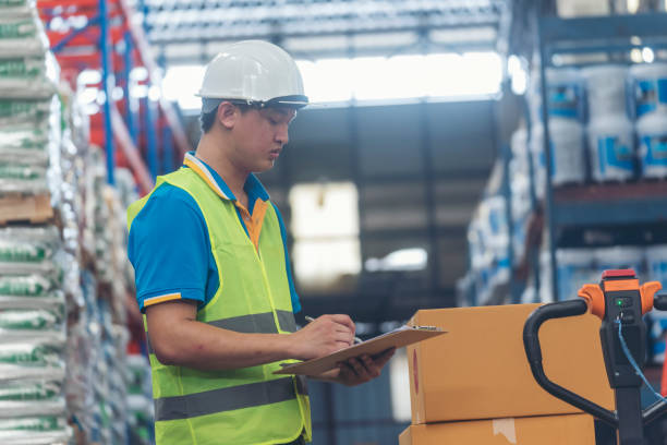 istock Asian men hands touch smart tablet Warehouse management logistics counting checking products on inventory shelf. Engineer Man hands worker check stock control in distribution storage checklist 1768062596