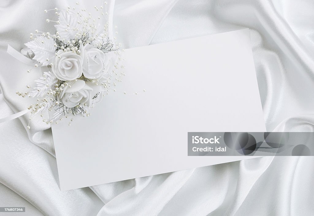 The wedding invitation The wedding invitation with a bouquet of the bride on a white background Arts Culture and Entertainment Stock Photo