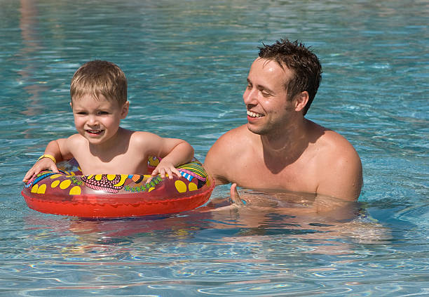 istock Father and Son in Swimming Pool 176808267