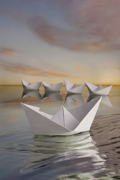 istock Apart from the crowd paper boat . 176808388