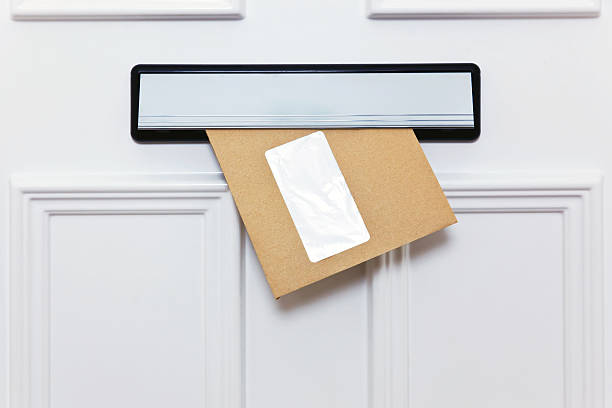 Brown envelope in a front door letterbox