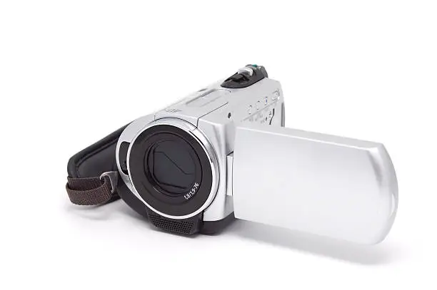 Videocamera. Isolated on a white background. A shade below.