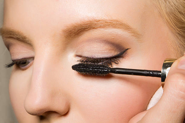 istock Close-up of a female applying make-up 176809785