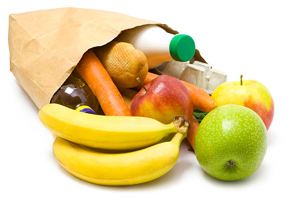 istock Paper bag on its side with fruit and vegetables spilling out 176809827