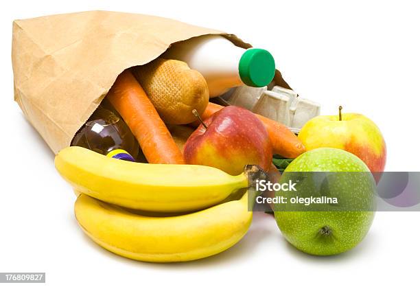 Paper Bag On Its Side With Fruit And Vegetables Spilling Out Stock Photo - Download Image Now