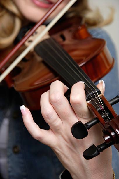 istock Woman playing the violin 176810111
