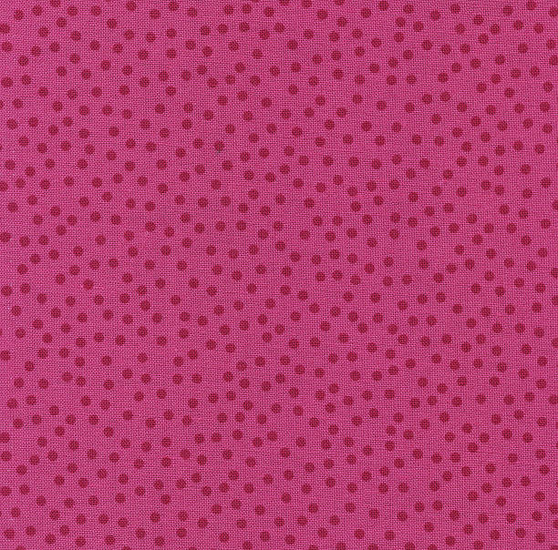 istock Red Polka Dots on Bright Pink Fabric for Backgrounds 176810156