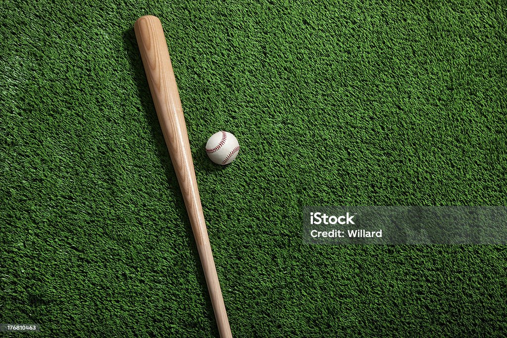 Baseball and bat on green grass Baseball and bat on green grass viewed from aboveSome others you may also like: Baseball - Ball Stock Photo