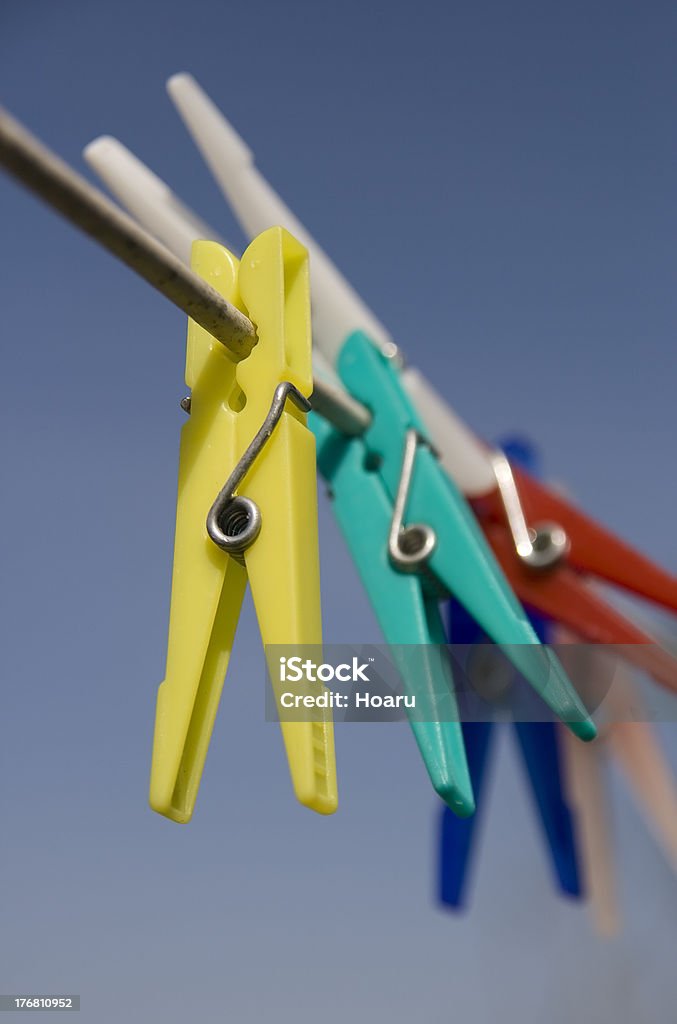 Colour Colthes Peg Against Blue Sky Clothes peg on a strig Arrangement Stock Photo