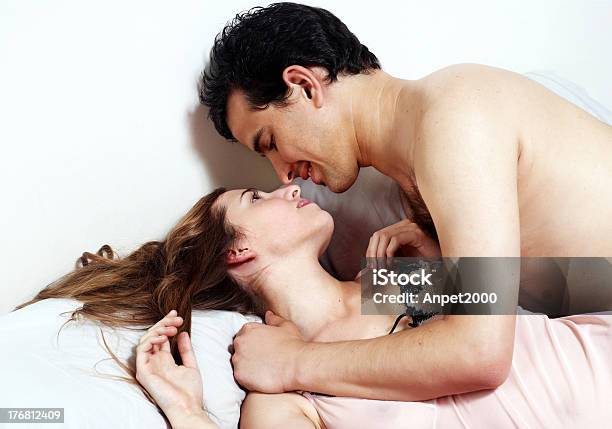 Young Attractive Happy Couple In Bedroom Stock Photo - Download Image Now - Bed - Furniture, Couple - Relationship, Adult