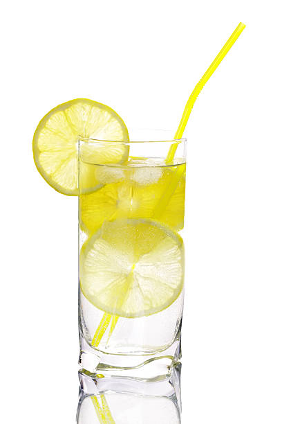 Glass of water with lemon isolated on white