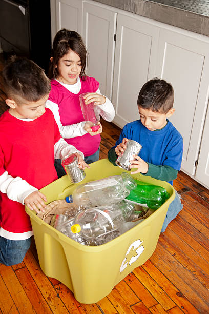 Go Green: Hispanic Siblings Recycling Together