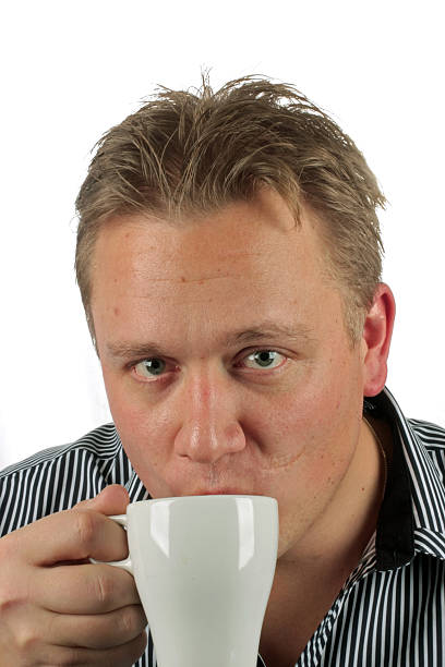 istock Young casual blonde guy drinking coffee 176812834