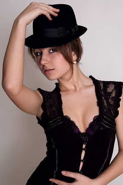 istock girl with black hat 176813205