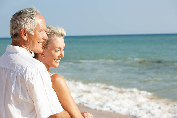 istock Senior Couple Enjoying Beach Holiday 176813693