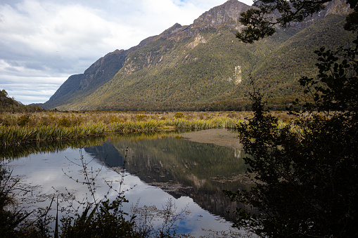 Mirror Lake, Fiordland, in New Zealand's South Island, on the Milford Highway