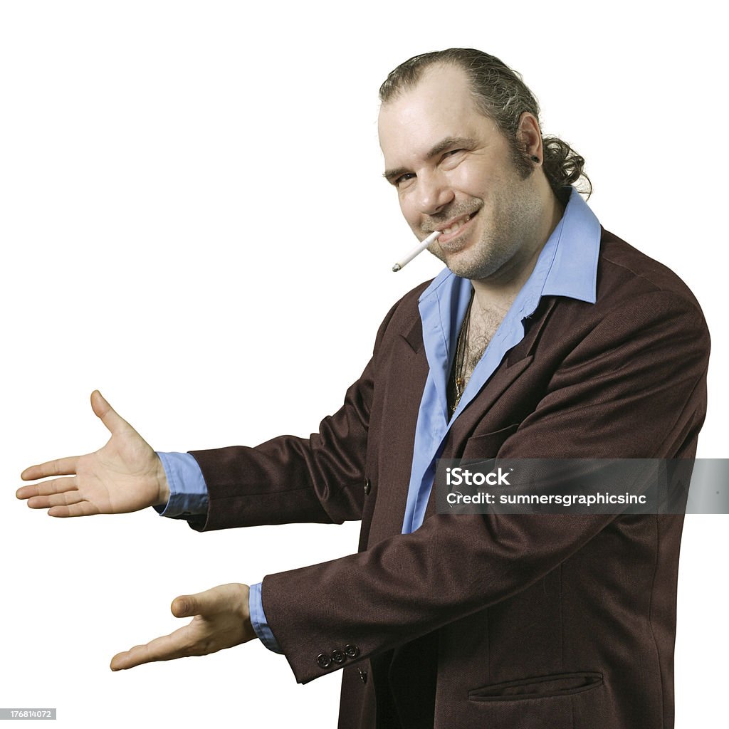 Sleazy salesman pointing "A sleazy car salesman, Con man, retro suit wearing man with happy smile showing you his deals." Car Salesperson Stock Photo