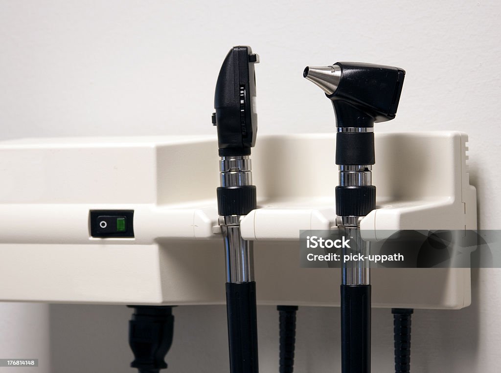 otoscope "Auriscope, or Otoscope hanging on wall." Doctor Stock Photo