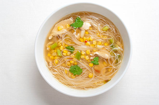 Thai chicken, corn and noodle soup stock photo
