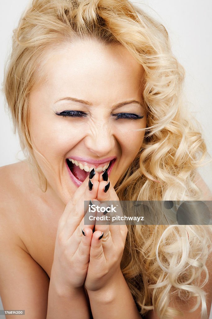 Happy girl "Happy blonde hair girl with suprised smile, eyes closed." 20-24 Years Stock Photo