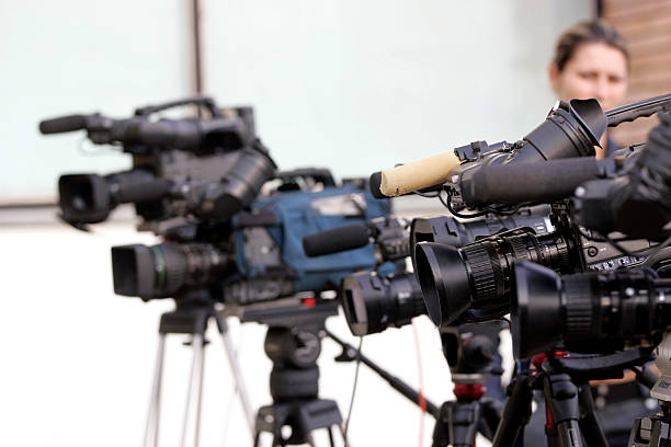 istock A closeup of a line of cameras pointed in the same direction 176815082