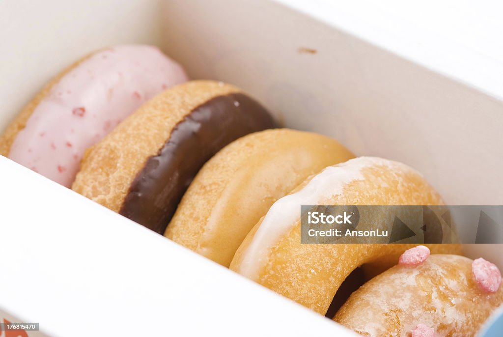 Insieme di deliziosi donuts carta nel riquadro - Foto stock royalty-free di Alimentazione non salutare