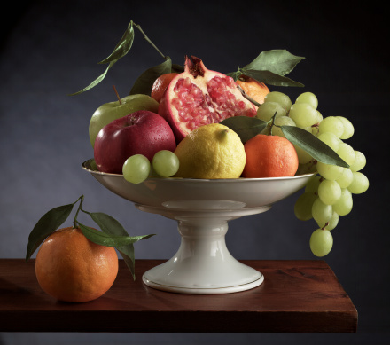 centrepiece with fruit on a wood table