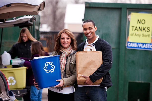 Group of people, volunteering together and cleaning a public park in the city.