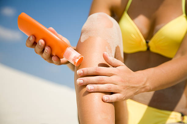 istock woman in bikini  smear protective cream 176817234