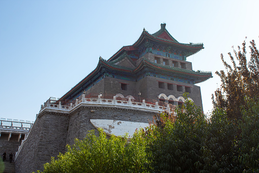 Close up on the archery tower of Zhengyangmen located at the south of Tiananmen, Beijing, China. Blue sky, background, vertical image