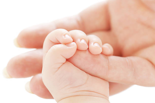 istock Hands of the child and mother 176818302