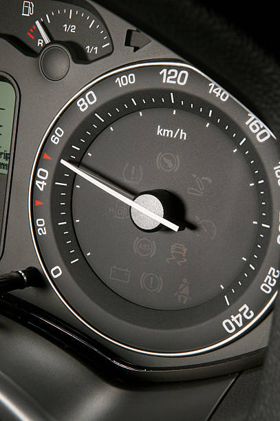 Tachometr showing lawful speed Black tachometer showing lawful speed in the city Revving stock pictures, royalty-free photos & images