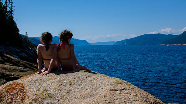istock Two Sisters on the rocks, Lake, Sea, bathing suit, Summer 176819258