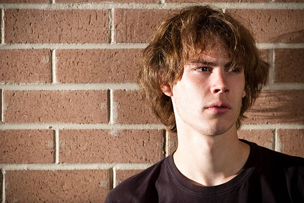 istock Teen man in front of wall 176819561