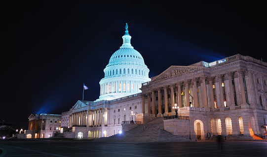 The Capitol Building in Washington, D.C., USA lit up in the early evening.