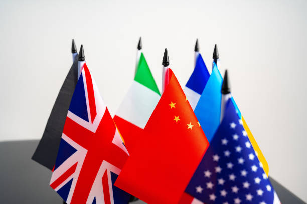 istock Lots of small national flags on table 1768198874