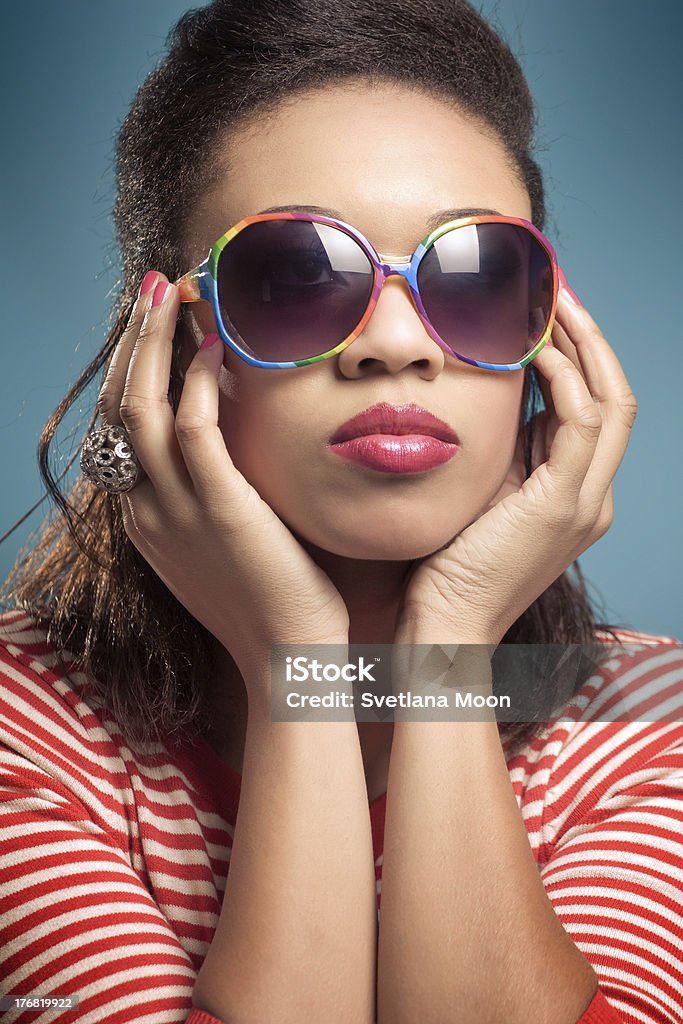 Retro chic Young beautiful woman wearing vintage sunglassesFrom this series: 1960-1969 Stock Photo