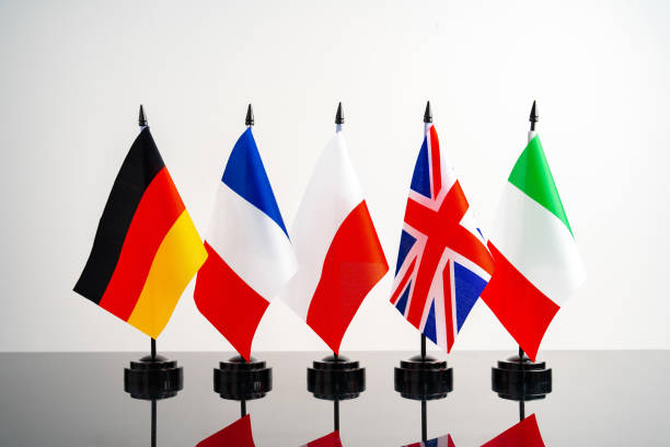 istock Lots of small national flags on table 1768199407
