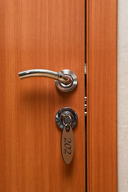 istock Door handles and key in keyhole 176820018