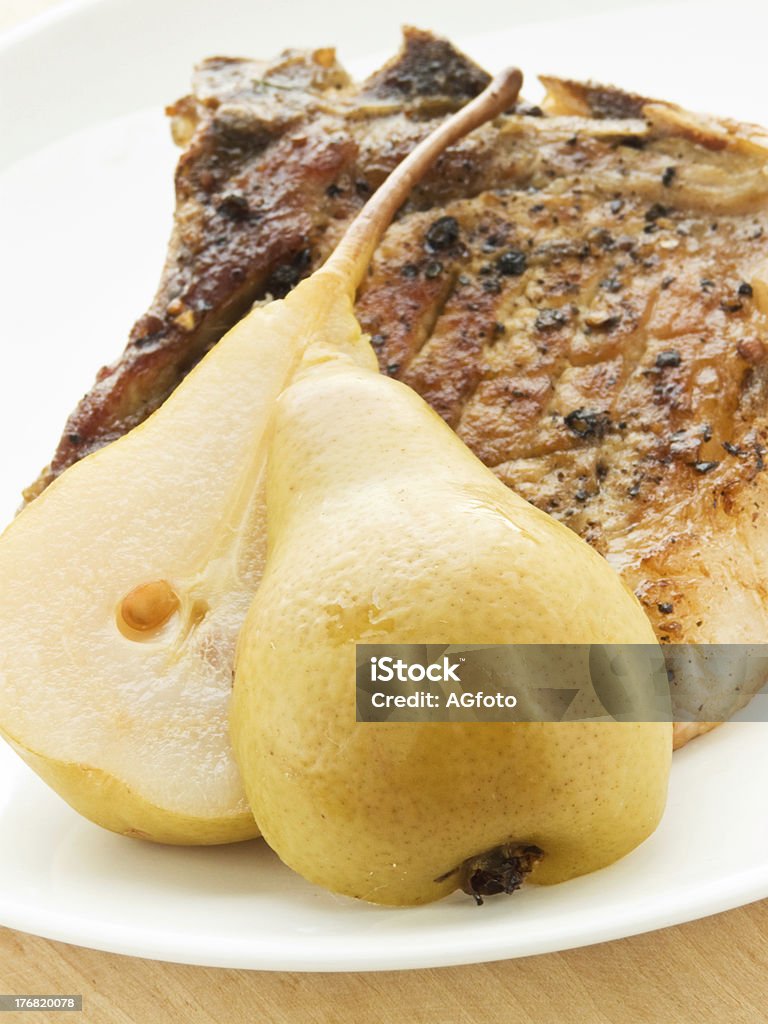 Steak Grilled pork steak with pears. Shallow dof. Appetizer Stock Photo