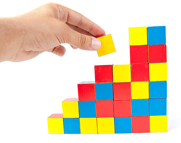 istock Man's hand holding wooden block 176820288