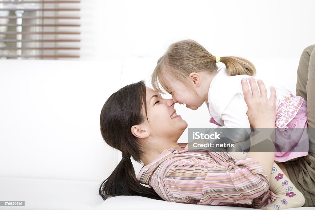 happy family mother and daughter having fun at home Adult Stock Photo