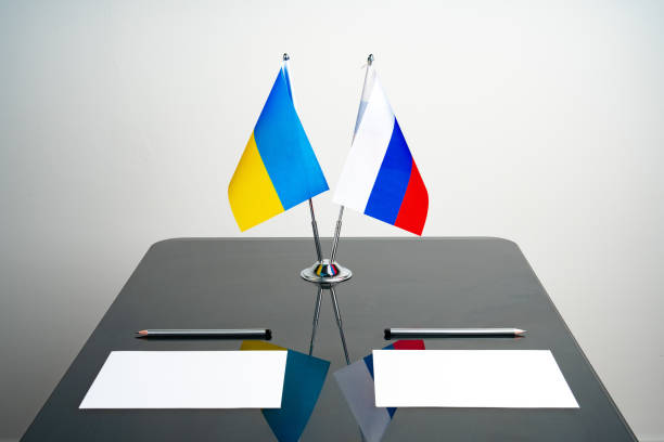 istock Russia and Ukraine flags on negotiation table 1768204269