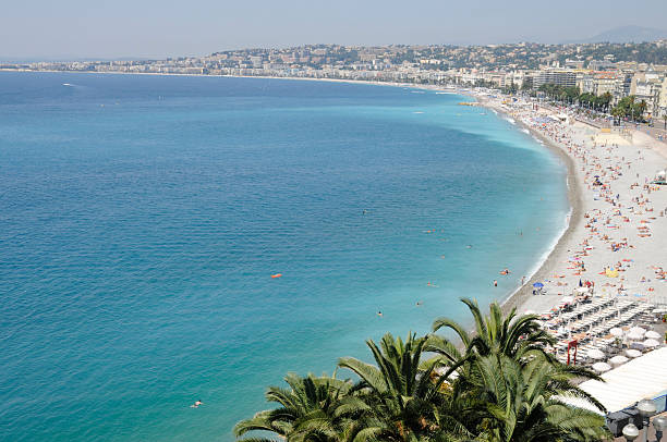 istock Sunbathers at beach gorgeous day in Nice, France.  Long view. 176820582