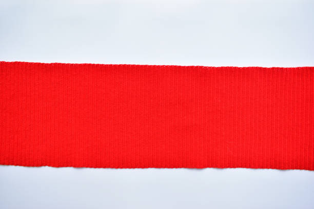 istock red wool knitted yarn texture, woolen fabric on white background 1768208982