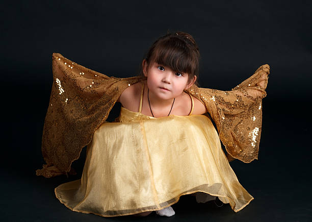 Little fashion model posin in studio.