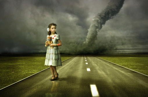 little girl large tornado over the road ( photo and hand-drawing elements combined. )