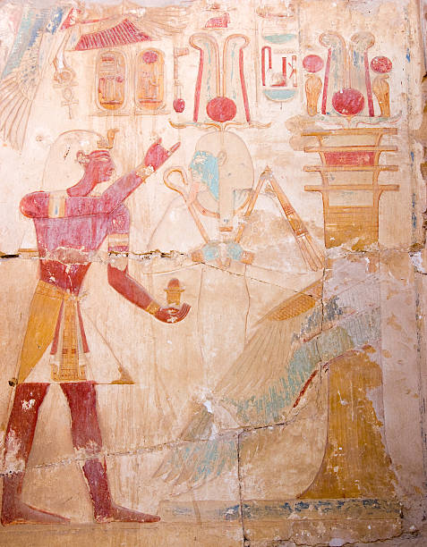 Ramses and Osiris, Ancient Egyptian carving "An ancient egyptian hieroglyphic carving of the Pharoah Ramses II with the god of the underworld Osiris.  Temple of Ramses, Abydos, Egypt." abydos stock pictures, royalty-free photos & images