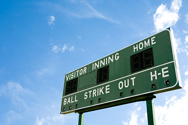 Blank baseball scoreboard against the sky stock photo